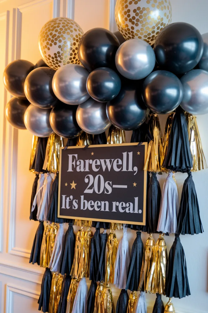 Farewell party decor with balloons and tassels featuring a sign saying Farewell, 20s—It’s been real.